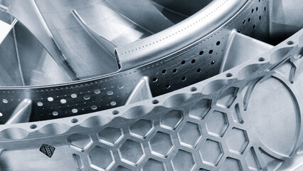 Poster - complex metal piece with a pattern created by a 3D printer. The lines are arranged in a spiral pattern, creating a sense of movement and energy. Adaptive technologies concept background