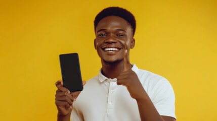 Aufkleber - Happy man shows smartphone screen with thumb up gesture against yellow background.