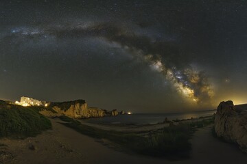 Wall Mural - stunning view of the milky way arching over a serene sea at night, milky way and starry sky at night