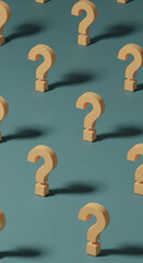 Poster - Beige question marks on teal background, arranged in a pattern, symbolizing inquiry, uncertainty, or FAQ concept, ideal for website or blog