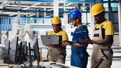Poster - all black inspectors team in photovoltaics factory look over documents, review performance of robot 