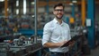 © AmStoock - portrait of a handsome young engineer stands in a mechanical workshop or industrial space