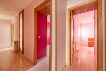Poster -  A long, well-lit hallway can create a sense of depth and spaciousness,