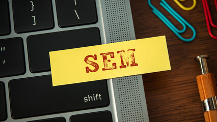 Poster - There is sticky note with the word SEM. It is an abbreviation for Search Engine Marketing as eye-catching image.