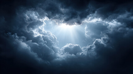 Wall Mural - dramatic dark stormy sky with thick clouds opening to reveal bright sunlight rays breaking through, 
