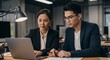 © Donjuan Studio - Analyzing Data on Laptop in Office with Colleagues
