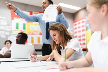 Fototapete - Students learning in classroom, diverse group with teacher instruct, diverse students focus on work. Classroom with diverse students learning, international school teacher and students in classroom