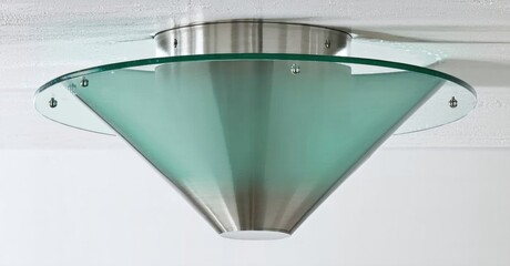 Poster - Ceiling fixture, modern design. Metal base supports frosted glass cone. Clean lines, simple aesthetic, mounted flush to ceiling.