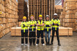 © Jack Tamrong - Photo group diversity wood warehouse workers standing arm cross working in wooden pallet distribution factory