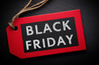 © lashkhidzetim - A red tag with black letters that says Black Friday. The tag is hanging from a string
