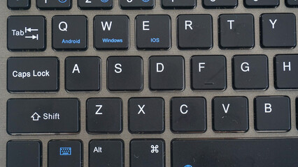 close up view of black modern wireless computer keyboard isolated on white background