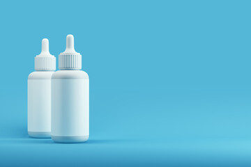 Poster - Two blank dropper bottles mockup with white labels for medical or cosmetic product branding on clean blue gradient background. 3D Rendering