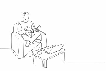 Poster - Single continuous line drawing man sit cross legged on sofa playing ukulele looking at laptop screen. Learn to play ukulele online. National Play Your Ukulele Day. One line design vector illustration