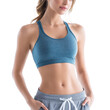 © PERFECTisME - A young woman poses confidently in a blue sports bra and gray shorts. showcasing her toned physique against a bright white background. ideal for fitness and lifestyle imagery