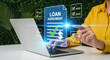 © ekhtiar - Woman reviewing digital loan agreement on laptop