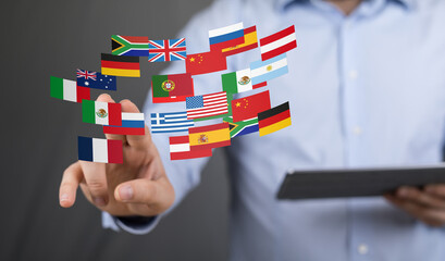 Poster - Image of a man interacting with digital flags representing global business and communication.