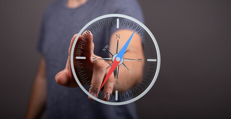 Aufkleber - High-quality image of a person interacting with a digital compass, illustrating navigation and direction.