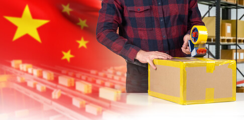 Poster - Packing parcels in China. PRC distribution center worker. Cropped man sealing box with tape. Packer working in factory in China. Fulfillment of goods in China. Packing box in delivery service