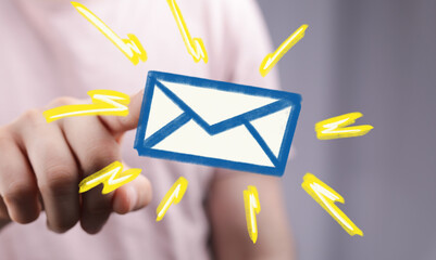 Aufkleber - Close-up of a hand interacting with a vibrant email icon, symbolizing online communication.