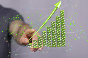 Poster - Stock photo of a hand interacting with a 3D bar graph showing upward growth, symbolizing business success.