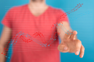 Poster - Stock photo of a person interacting with a digital graph showing data trends and analysis.