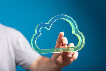Poster - Hand interacting with a digital cloud, symbolizing data access and cloud services.