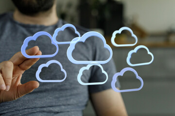 Poster - Person using finger to interact with digital cloud icons representing data storage and cloud computing.