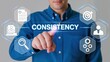 © David Zarzosa - Businessman interacting with floating icons representing consistency and performance. Professional consistency, strategic work flow, business reliability.