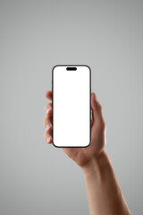 Poster - Realistic smartphone in male hand on gray background with dramatic lighting, perfect for showcasing premium app UI, tech products, or mobile concepts