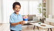 © Ljupco Smokovski - Boy holding an ice cream in a cup