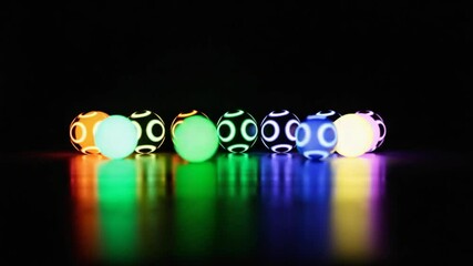 Wall Mural - abstract glowing spheres in dark space reflecting vibrant neon colors