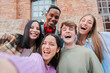© Jose Calsina - A cheerful group of friends enjoying their time together, taking a spontaneous selfie to cherish their joyful moments, laughter, and camaraderie, highlighting the essence of friendship and youth.