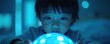 © val - A focused child interacts with a glowing, blue orb, encapsulated in an enchanting, dimly lit atmosphere, evoking curiosity and wonder.