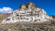 © Li - Volcanic peak with white mineral formations, a geological wonder in the desert