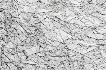 Poster - Black and white grunge texture with cracks and rough edges detailed close up of crumpled white paper with dark lines creating a textured appearance.