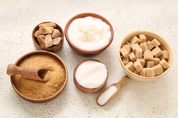 Wall Mural - Bowls with different types of sugar on white background
