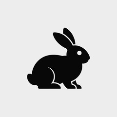 Aufkleber - Black Silhouette of a Rabbit Sitting on a Light Gray Background Simple Vector Graphic Design Element