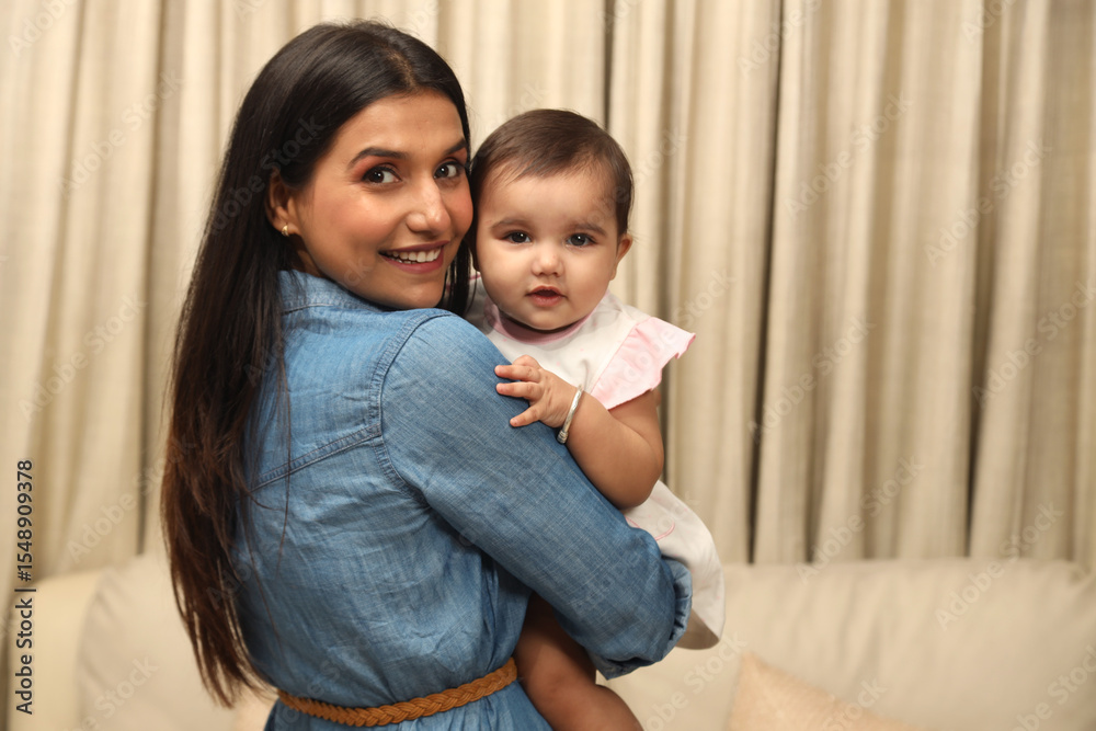 Close up of happy young indian mother hug cuddle little infant or ...