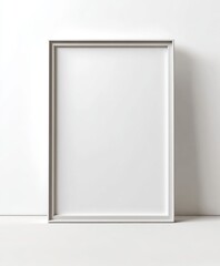Poster - Empty Silver Picture Frame Leaning Against White Wall with Shadowing and Minimalist Style
