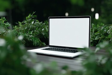 Aufkleber - Laptop Computer with Blank Screen Surrounded by Green Plants in Outdoor Garden Setting for Work and Technology Concept