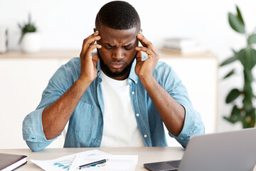 Poster - Headache Concept. Stressed Black Man Suffering From Migraine At Workplace, Tired African American Guy Sitting At Desk With Laptop And Touching Temples, Having Strong Pain Or Blood Pressure, Free Space