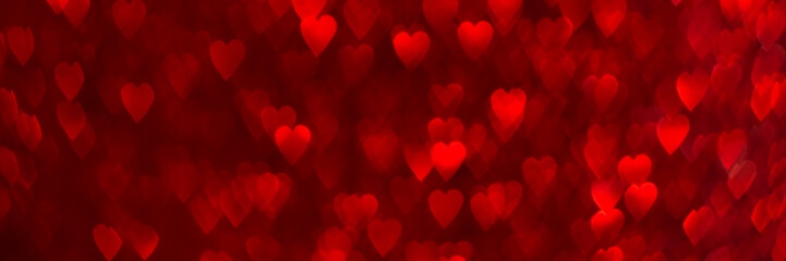 Wall Mural - Red hearts, sparkling glitter bokeh background banner, valentines day abstract defocused texture header