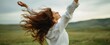 © Studio Nova - The woman embracing freedom with flowing hair in a beautiful natural landscape.