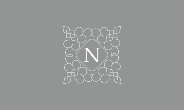 Elegant logo template for restaurant, boutique, cafe, hotel jewelry, fashion with initial N. Vector floral monogram.