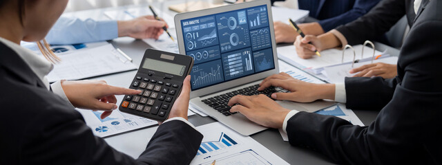 Poster - Business intelligence and data analysis concept. Analyst team working on financial data analysis dashboard on laptop screen as marketing indication for effective business strategic planning. Insight
