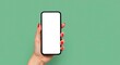 © Steffani - Woman's hand holding a black smartphone with a blank white screen display