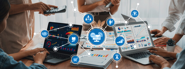 Poster - A group of professionals engages in a dynamic business meeting, showcasing laptop screens filled with charts and data visualizations, fostering collaboration and innovation. Amity