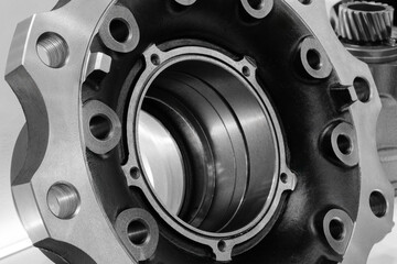 Poster - Close up of a wheel with many holes in it. wheel is black and silver. holes are evenly spaced and wheel is almost completely covered in them