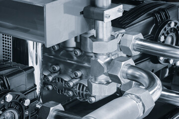 Aufkleber - Machine with a silver pipe and a black part. The machine is made of metal