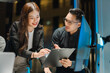 © Kritdanai - Business Colleagues Discussing Project in Office
